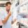 Tiendas de perfume en Madrid - Hombre rubio toma un frasco de perfume para oler su fragancia antes de comprarlo en una tienda de Madrid